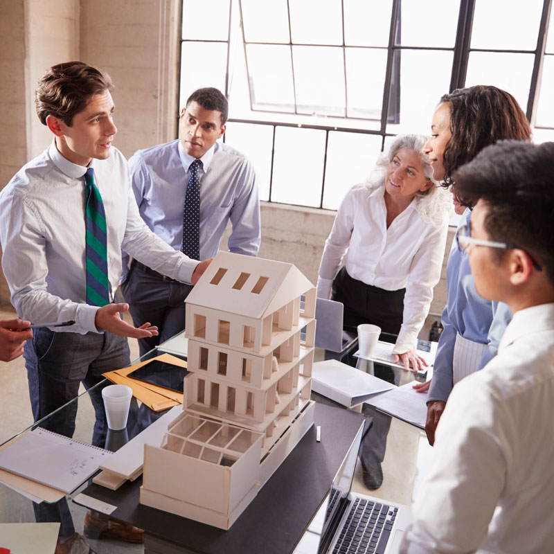 Architect presenting a design model to business